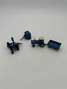 1/64 Ertl Ford Farm Set With TW-20, Baler, Plow, and Wagon - Picture 1 of 3
