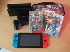 Nintendo Switch + 3 giochi e custodia e accessori compresa scatola originale.
