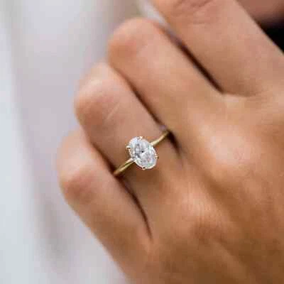 Anillo solitario de diamantes de oro amarillo de 14 k de corte ovalado E VVS1 CVD cultivado en laboratorio de 1,06 quilates Foto 1 de 4