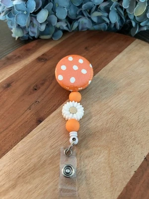 Cuentas de silicona con lunares naranjas retráctiles nombre de identificación insignia carrete girasol Foto 1 de 2