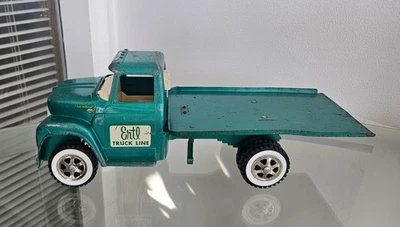 CAMIÓN DE PLATAFORMA INCLINABLE LOADSTAR COSECHADORA INTERNACIONAL DE ACERO PRENSADO ERTL DE COLECCIÓN Foto 1 de 4