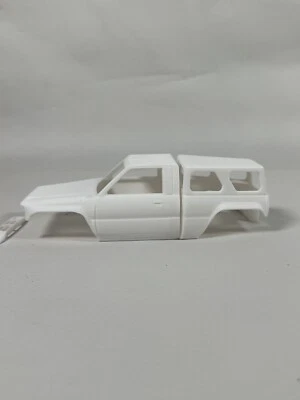 Axial Scx24 Pinched Toyota Body With Pinched Camper And Sliders- 24th Scale - Image 1 of 4