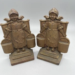 Pair of vintage cast metal bookends depicting Dutch milkmaids with buckets - Picture 1 of 8