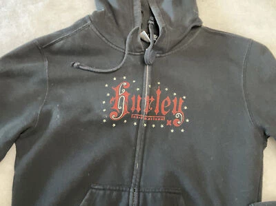 Sudadera con Capucha Hurley Negra Logo y Estrellas Negra Para Mujer Talla L Foto 1 de 4