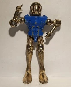 Robot In Metallo Anni 70 Snodato 90mm. Marca Zylmex Ottone/Blu - Foto 1 di 8