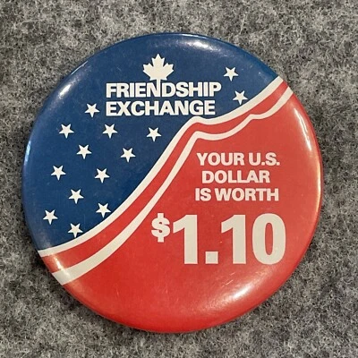 USA Canada Friendship Exchange Dollar Worth 1.10 Flag Stars Red Button Lapel Pin - Image 1 of 4