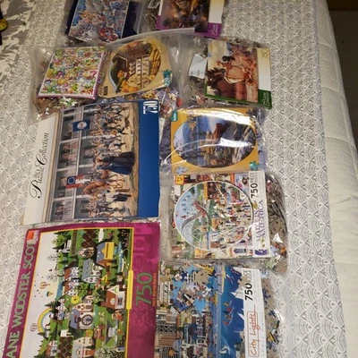 Lot Of 10 Colorful 750 Piece Puzzles Muliple themes - Image 1 of 4