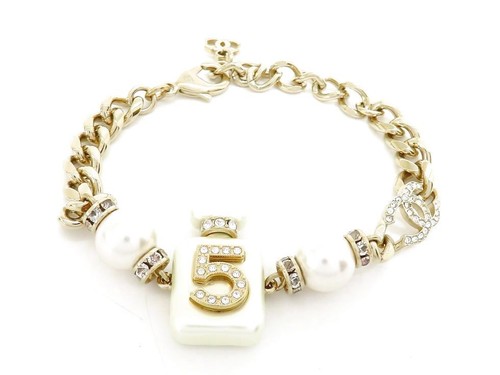 Bracciale Chanel AB8479 GP metallo perle e strass marchio cocco n.5