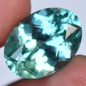 Piedra preciosa tratada ovalada de zafiro natural bicolor impecable de 12,55 quilates con certificación AGL - Imagen 1 de 7