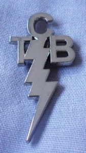 Pretty Green ' Taking Care of Business ' TCB Silver / Nickel coloured pin badge. - Picture 1 of 1