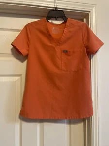 FIGS Scrub Top Donna XS Tinta Unita Arancione Tasca Logo Medico Manica Corta Scollo V - Foto 1 di 6