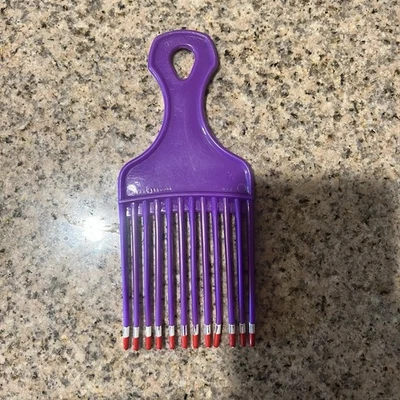 Pente de elevação vintage década de 1980 EUA patente 4345608 cor de cabelo pente roxo 7” - Imagem 1 de 4