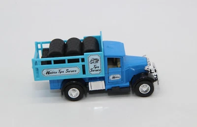 Camión Open Welly Modern Tyre Service azul tirador trasero No. 9350 Foto 1 de 4