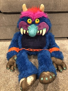 80s toy monster with handcuffs