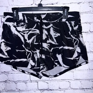 Pantalones cortos de running DSG para mujer blancos y negros medianos - Imagen 1 de 7