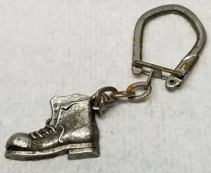 Gehäkelter Schlüsselanhänger Chausseur Blois französisches Schuhgeschäft Metall Vintage - Bild 1 von 6