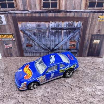 Chevrolet 1991 auto de carreras azul #1 Chevy interior blanco años 90 Hot Wheels Foto 1 de 4