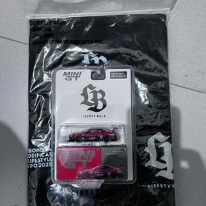 Set - Mini GT Nissan LB-ER34 Super Silhouette Skyline IMX 2025 with T-Shirt - Picture 1 of 2