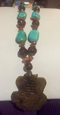 NEW, WOMEN'S TURQUOISE AND AMBER BEAD NECKLACE WITH BROWN CARVED BONE PENDANT - Image 1 of 4