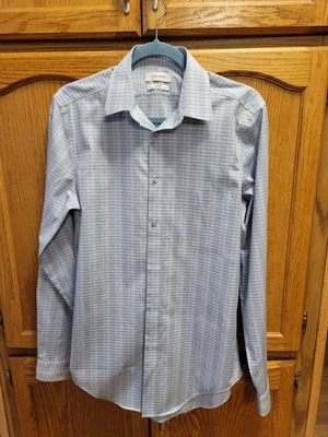 NUEVO SIN ETIQUETAS. Camisa de vestir azul de acero ajustada sin hierro de Calvin Klein talla 15M 34/35 Foto 1 de 4