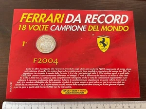 Medaglia FERRARI DA RECORD F 2004 18 volte Campione del mondo blister sigillato - Picture 1 of 2