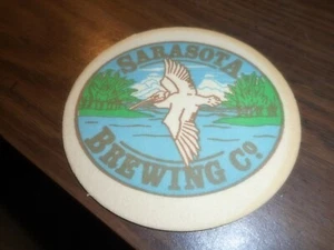 BEER Collectible Pub COASTER Sarasota Florida Brewing Company Pelican ? Bird - Imagen 1 de 8