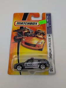 MATCHBOX 2006 MBX METAL DODGE MAGNUM POLICE CAR #38 METALFLAKE GUNMEATAL NIP - Picture 1 of 2