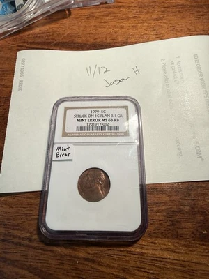 1979 NICKEL STRUCK ON CENT BLANK ERROR NGC MS-63 - UNCIRCULATED - SLABBED - 5C - Image 1 of 3