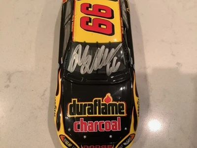 RUSTY WALLACE AUTOGRAPHED 2004 DODGE INTREPID DURAFLAME REVERSE DIECAST & CARD - Image 1 of 4