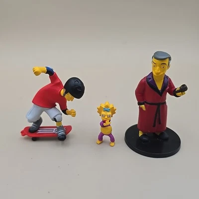 Lote de figuras de Los Simpson Neca Hugh Heffner Maggie Tony Hawk 2013 25 aniversario Serie Foto 1 de 4