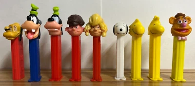 Pez - Pluto no feet, goofy, wood stock, Snoopy. Fozzy Bear, boy and girl - Image 1 of 4
