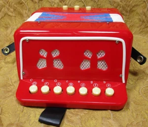 gently used working child's toy plastic bright red accordion squeeze box - Picture 1 of 8