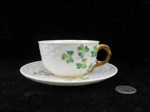 IRISH BELLEEK SHAMROCK TEA CUP AND SAUCER with BLACK BACK STAMP - Picture 1 of 3