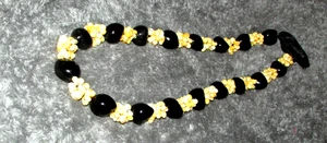 luau lei kukui nut 28" long (sew rm cab F) - Bild 1 von 3