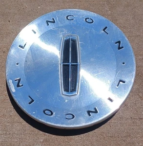 Lincoln Town Car Zephyr center cap, 2003-2006 part # 3W13 1A096 AA 04 - Picture 1 of 3
