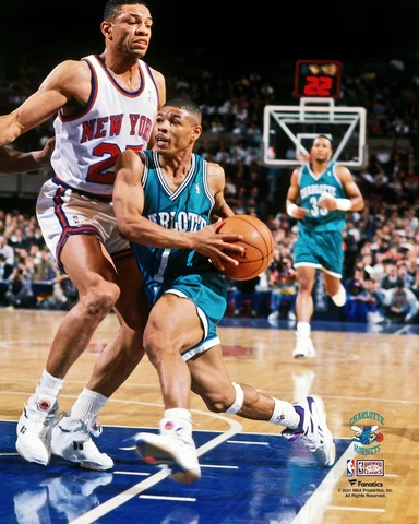 Muggsy Bogues Hornets Unsigned Teal Jersey Driving Towards Hoop vs Knicks Photo Cover