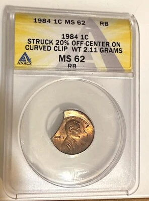 1984 Lincoln Cent Struck 20% Off Center on Curved Clip Planchet ANACS MS62 RB - Image 1 of 4