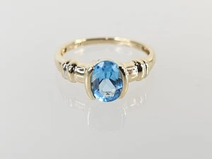 Anillo Topacio Azul Ovalado Oro Amarillo 10K APX 1 1/3 CTW Talla 7 (AM1083433) - Imagen 1 de 8