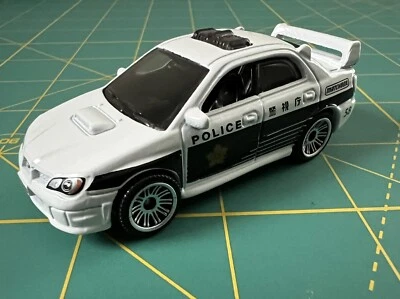 2024 MATCHBOX (LOOSE) - SUBARU IMPREZA POLICE JAPAN CRUISERS MULTIPACK EXCLUSIVE - Image 1 of 2