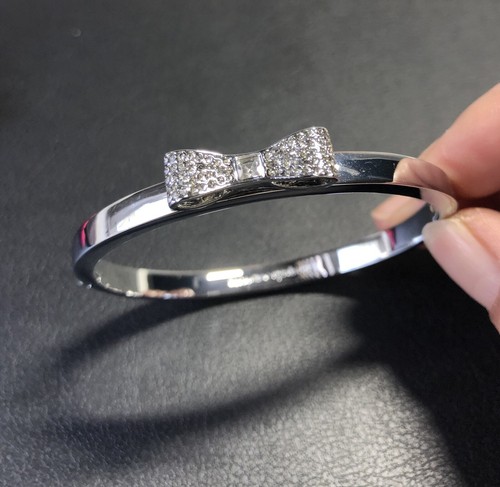 NUOVO bracciale Kate Spade NY cristallo fiocco cerniera colore argento con ricevuta