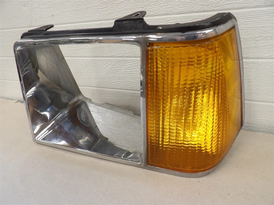 FORD ESCORT MERCURY LYNX 1981-1985 LH FARO LATERAL BISEL CROMADO OEM Foto 1 de 4