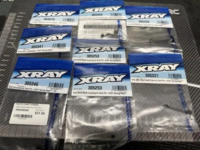 XRAY T4 PARTS LOT - DRIVE SHAFT PARTS 305334 305221 305346 305341 305328  - Image 1 of 4