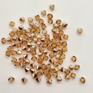 24pc Swarovski Crystal Metallic Sunshine 4mm Bicone 5328 Beads; Metallic Gold - Picture 1 of 2