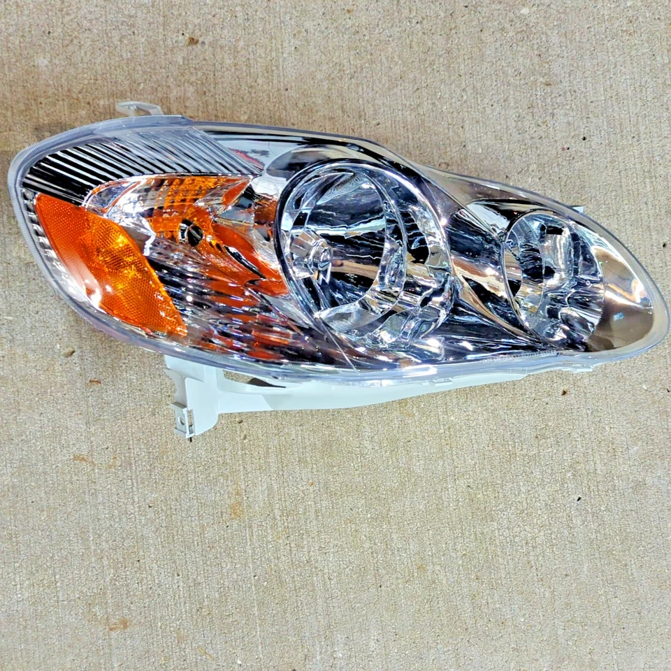 81110-02200 for 2003-2004 Toyota Corolla RH Passenger Side Headlamp Gray Housing - Image 1 of 4