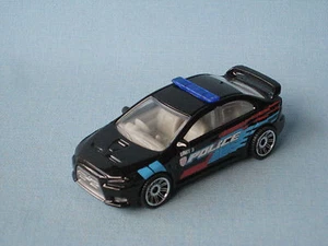 Matchbox Mitsubishi Lancer Evolution X Evo Police schwarz Spielzeug Modellauto 1:64 - Bild 1 von 4