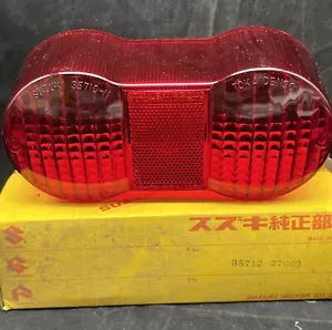 RR@3.36 Suzuki GT750 GT550 GT380 Tail Light Lens Nos OEM 74-76 35712-27691 - Foto 1 di 5