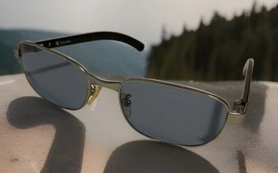 Gafas de sol Calvin Klein CK1022, montura negra / lente azul claro hechas en Italia Foto 1 de 4