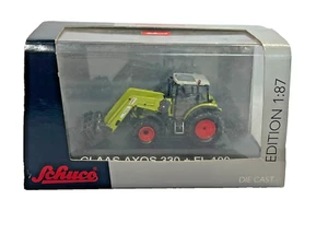Schuco 1:87 25597 Claas Axos 330 + FL 100 Tractor in Original Box - Picture 1 of 6