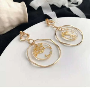 Clip on gold and glitter circle dangle wavy hoop earrings - Picture 1 of 2