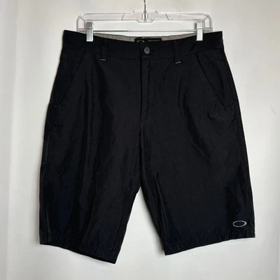 Pantalones Cortos Informales Oakley Para Hombres Negros Talla 32W Board Shorts Informales Frente Plano Foto 1 de 4